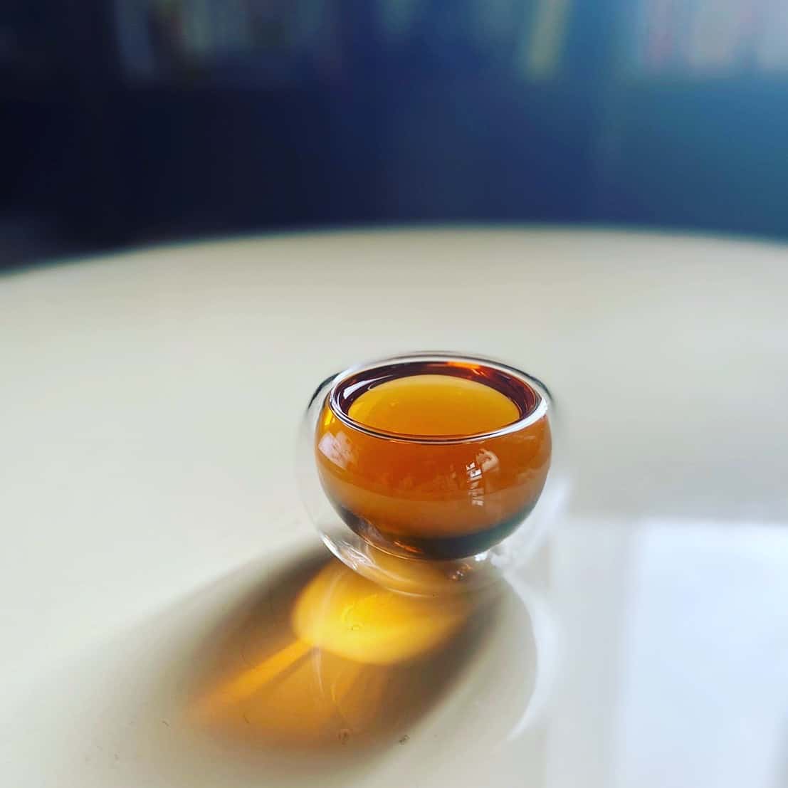 Hot tea being poured into a cup